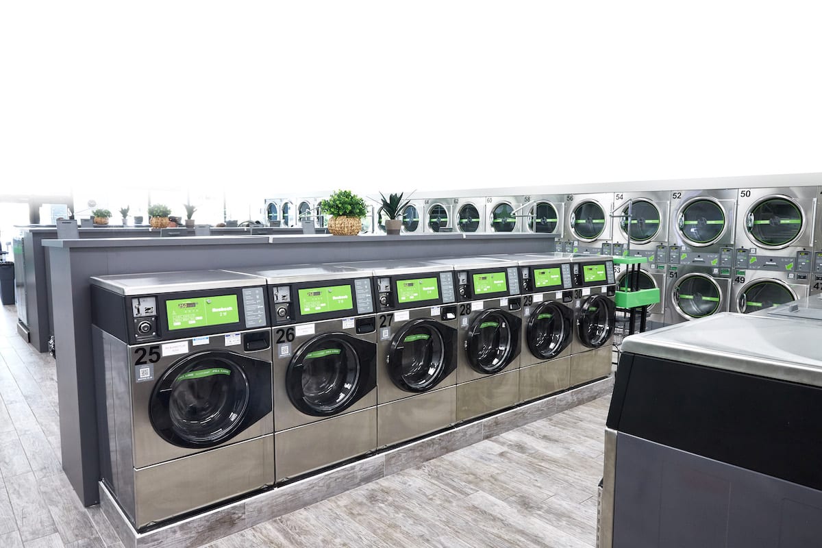 rows of Huebsch washing machines