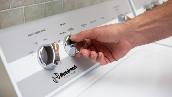 Military hand turning dial on machine