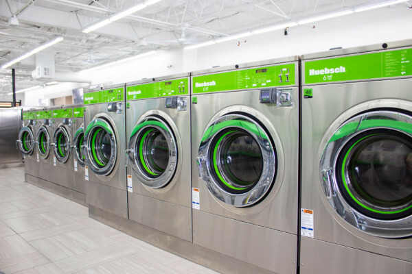 angled view of washing machines in laundromat