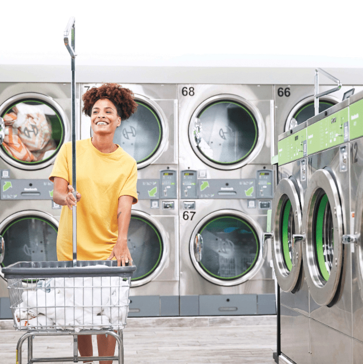 woman doing laundry in Huebsch laundromat