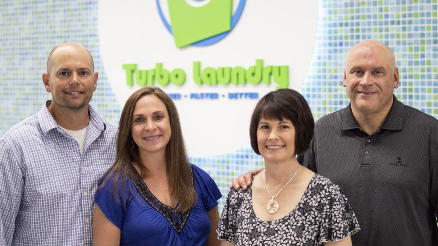 four team members from Turbo Laundry