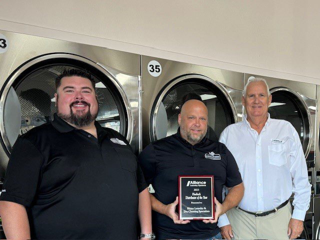 Left to right, Zach Brewer, and Clint Hedberg, co-owners of Rhino, and Jeff Bailey, Senior Regional Sales Manager for Alliance Laundry Systems